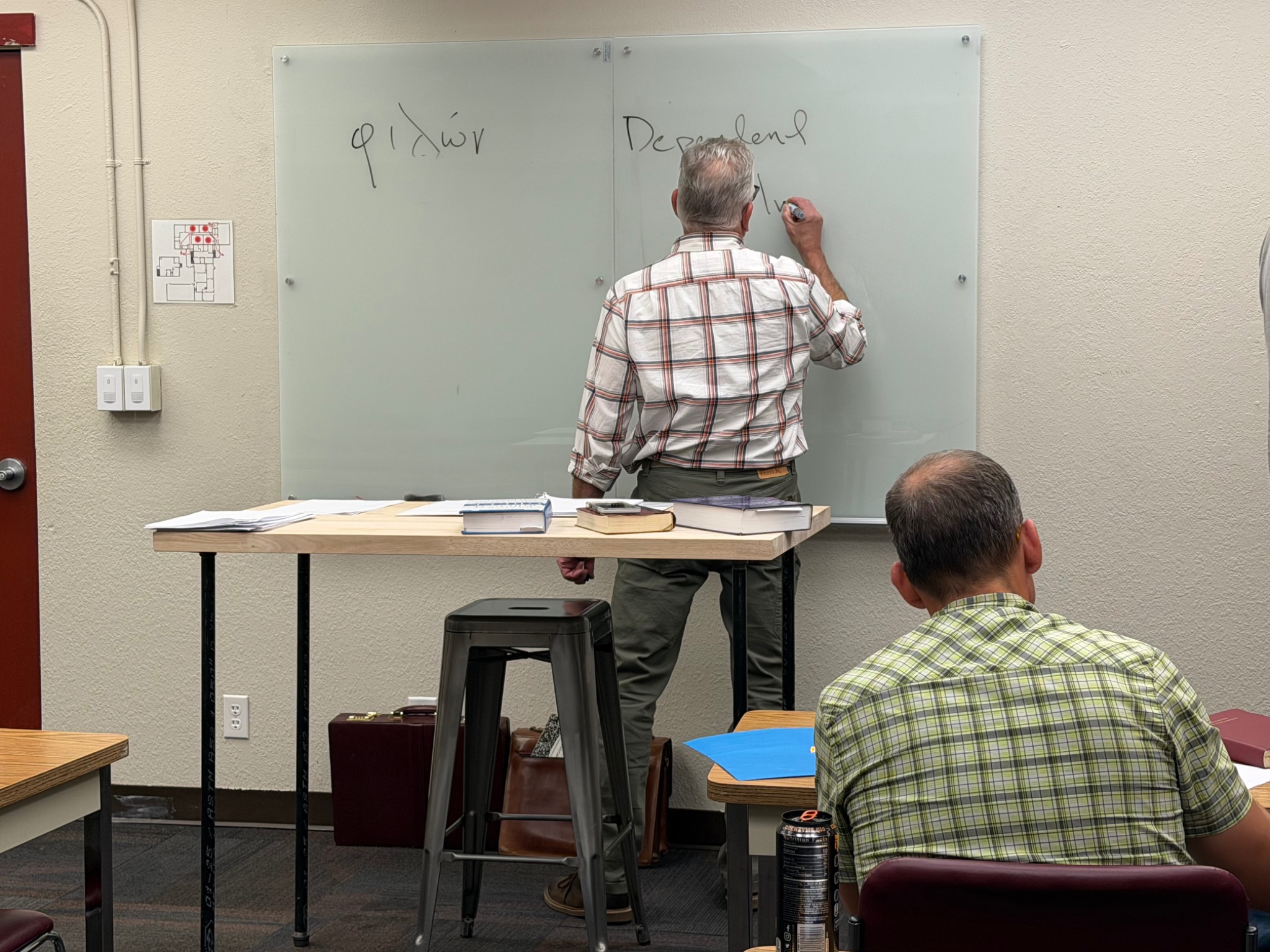 Students learning in an Alaska Bible College New Testament Greek class