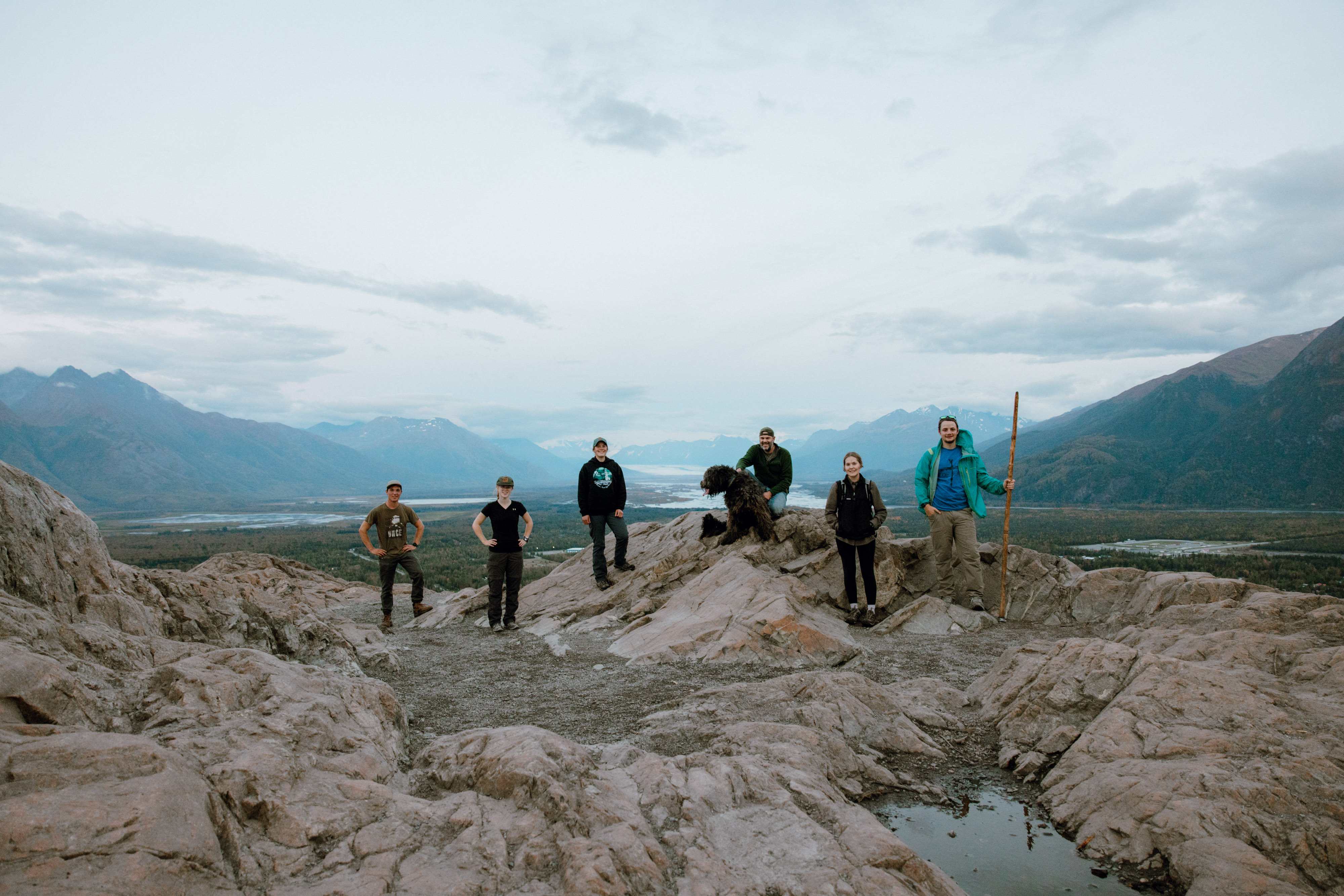 Alaska Bible College students overlooking an Alaska mountain landscape